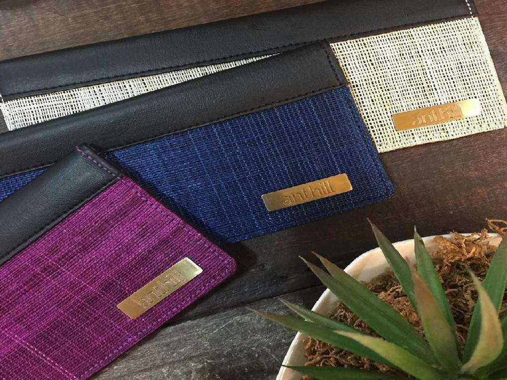 woven checkbook holders are fast moving off the shelves.