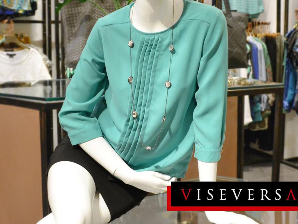 A great way to wear pastels at work is to combine them with darker pieces for a more balanced look